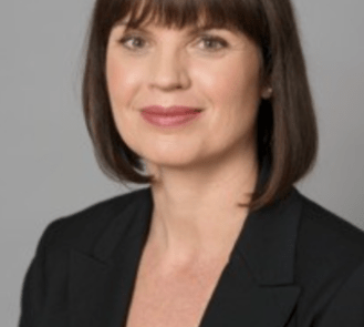 A headshot of a woman with short black hair