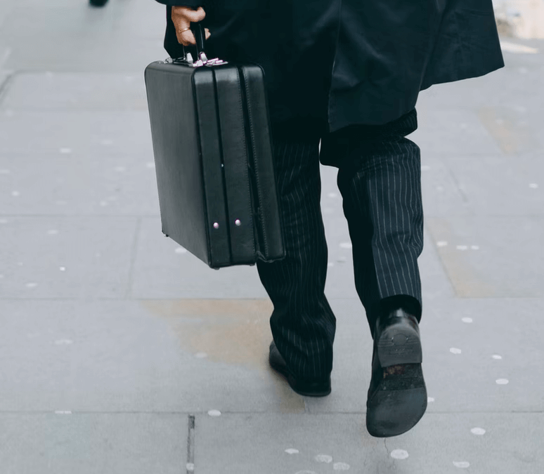 A man walking with a briefcase.